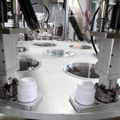 Automated Assembly Machine For Laundry Lids With Turntable Operation And Elevator Type Loading